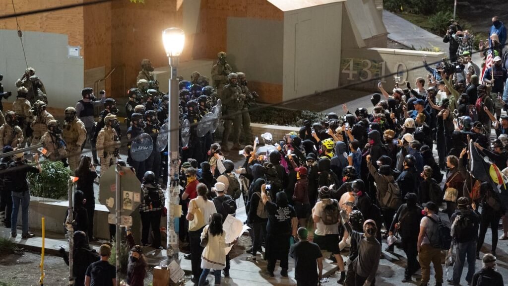 Protests erupt at ice building following trump's troop deployment announcement